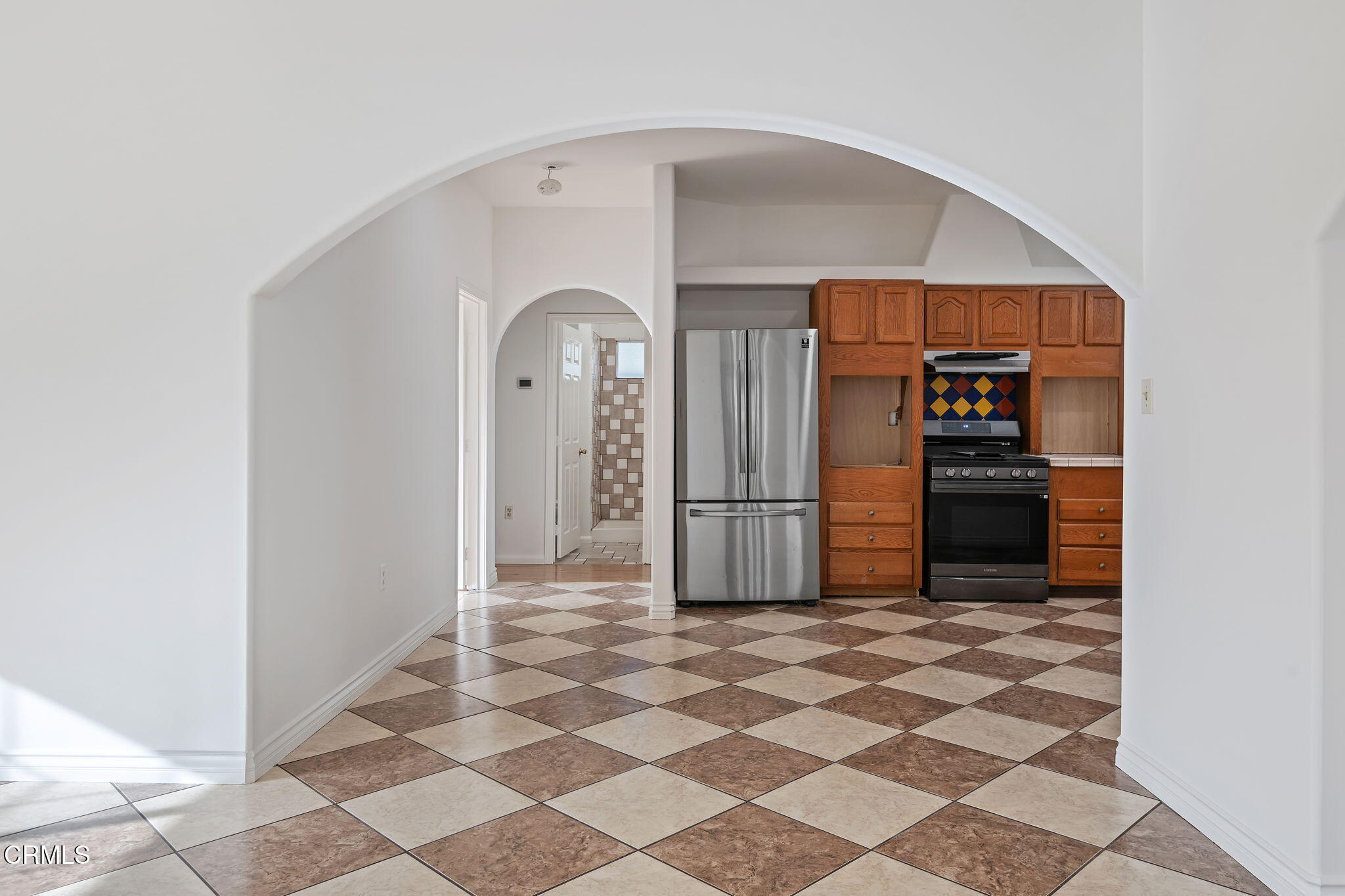 717 West Villanova Road Ojai, CA 93023 - Photo 14 of 33 a view of a refrigerator in kitchen and an empty room