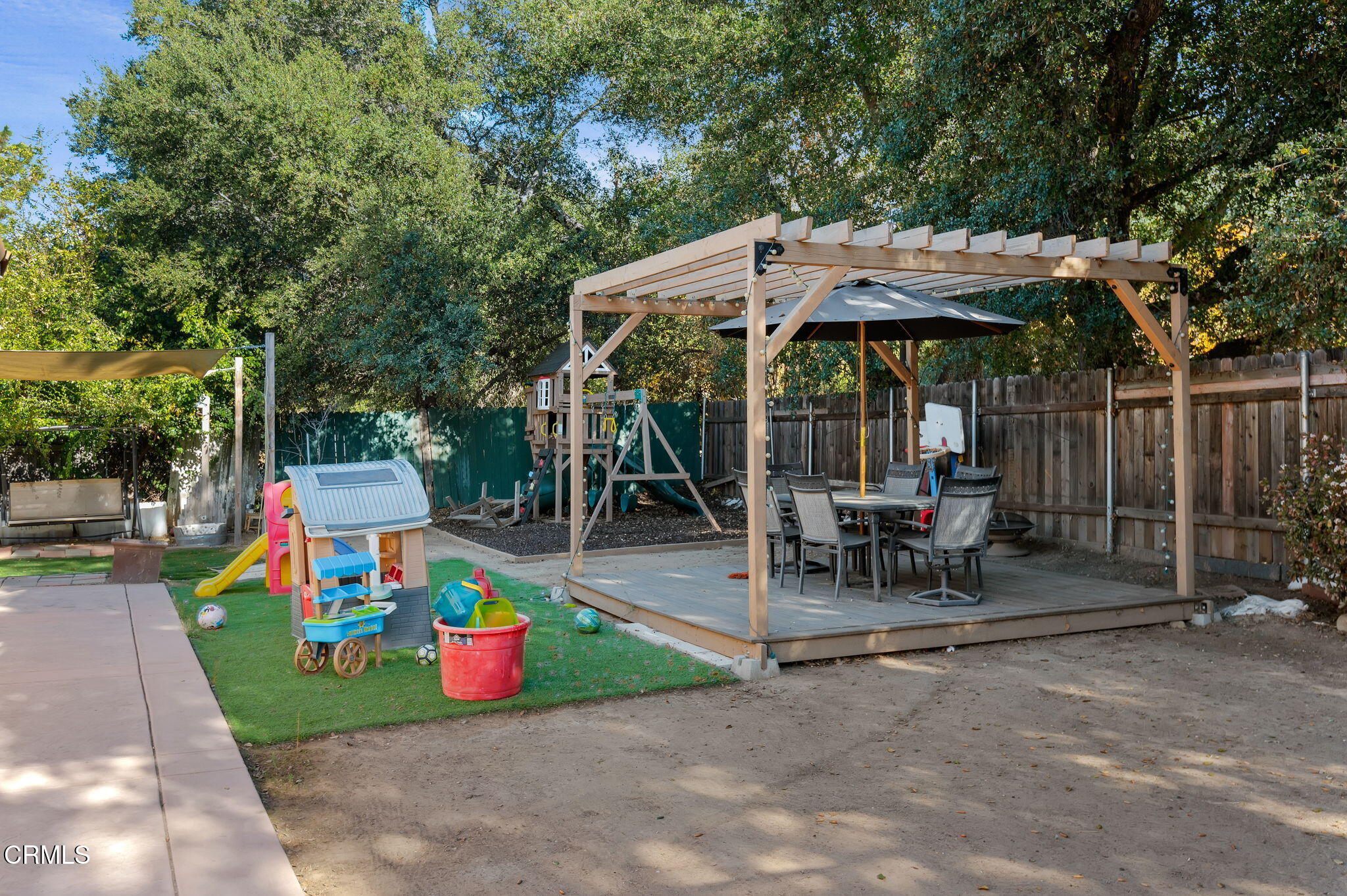 717 West Villanova Road Ojai, CA 93023 - Photo 27 of 33 a view of a patio with table and chairs under an umbrella