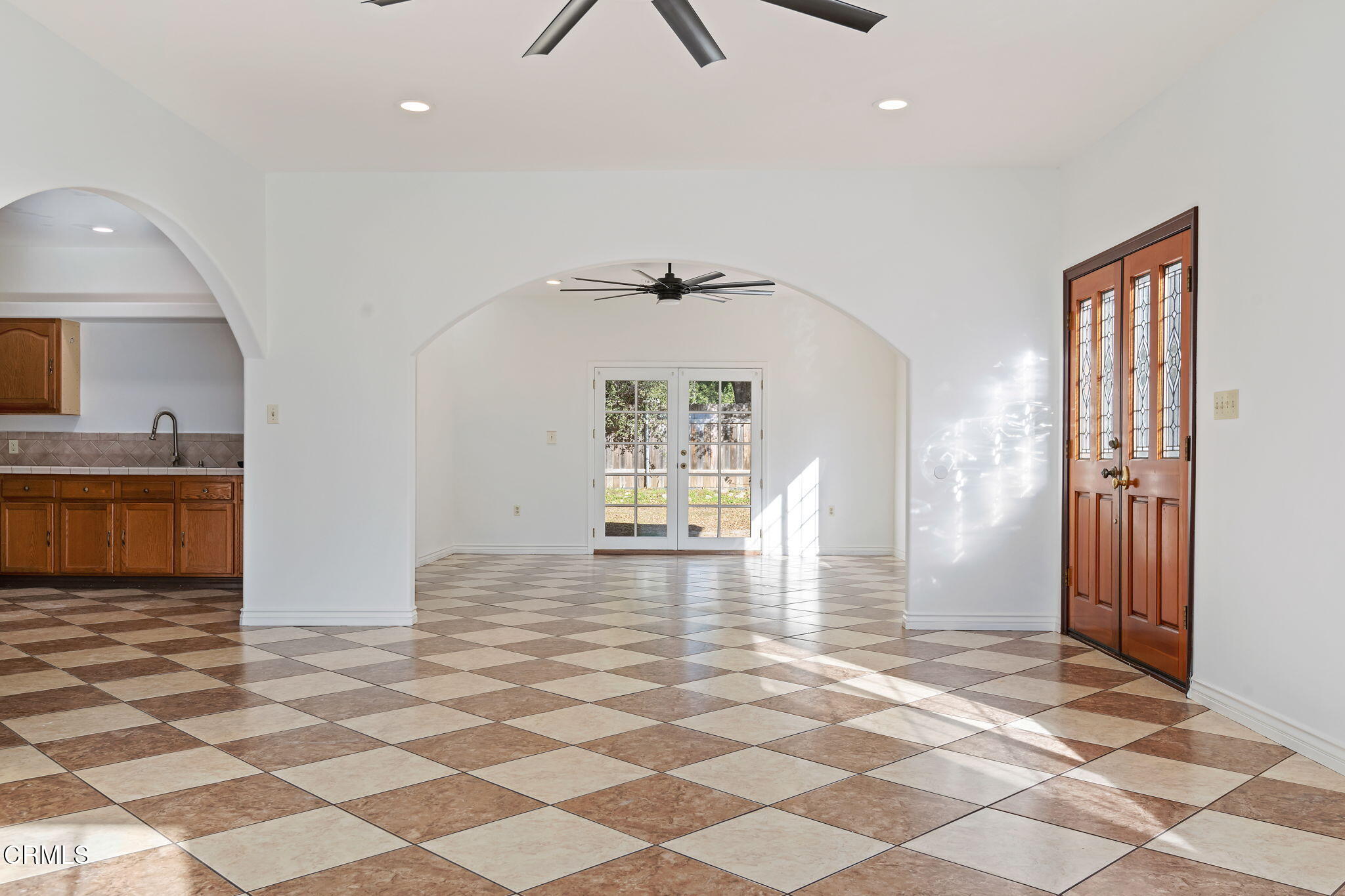 717 West Villanova Road Ojai, CA 93023 - Photo 9 of 33 a view of a hallway with wooden floor and a living room