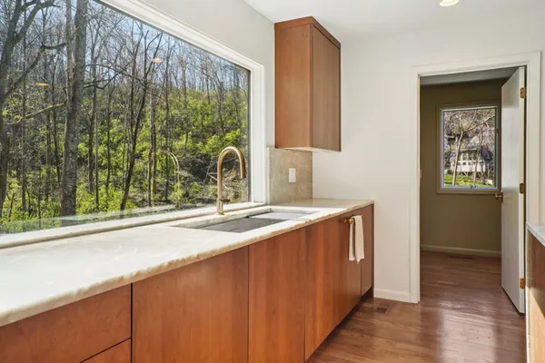a bathroom with a double vanity sink mirror and