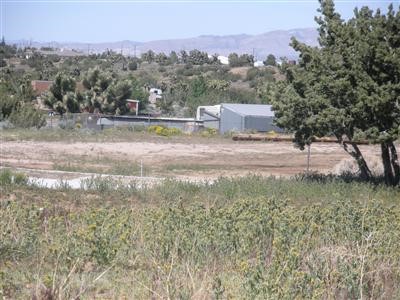 a view of a town with mountains in the background