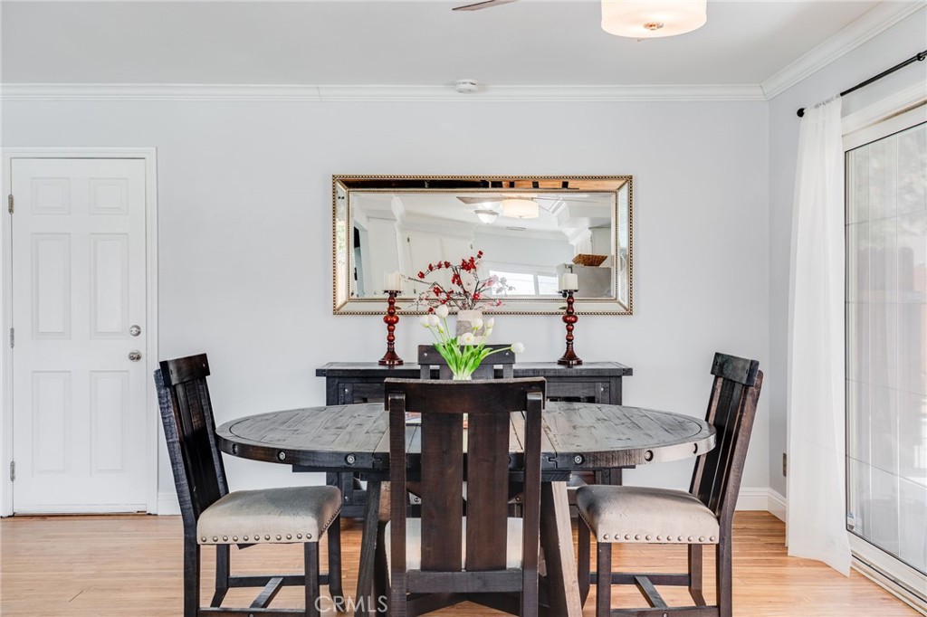 1935 Adobe Avenue Corona, CA 92882 - Photo 11 of 45 a view of a dining room with furniture and wooden floor