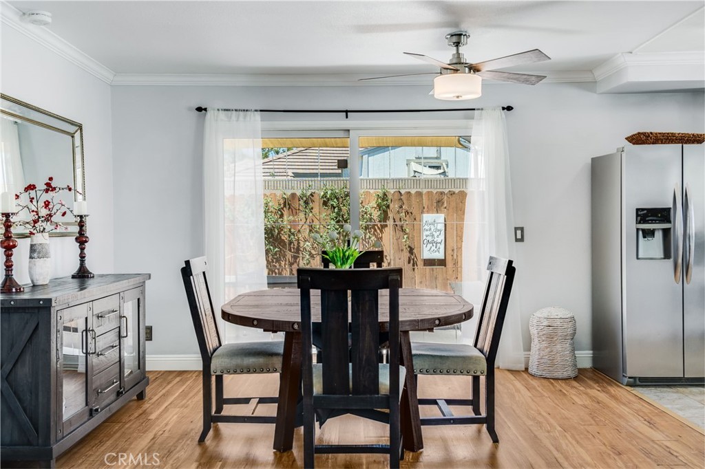 1935 Adobe Avenue Corona, CA 92882 - Photo 12 of 45 a view of a dining room with furniture window and wooden floor