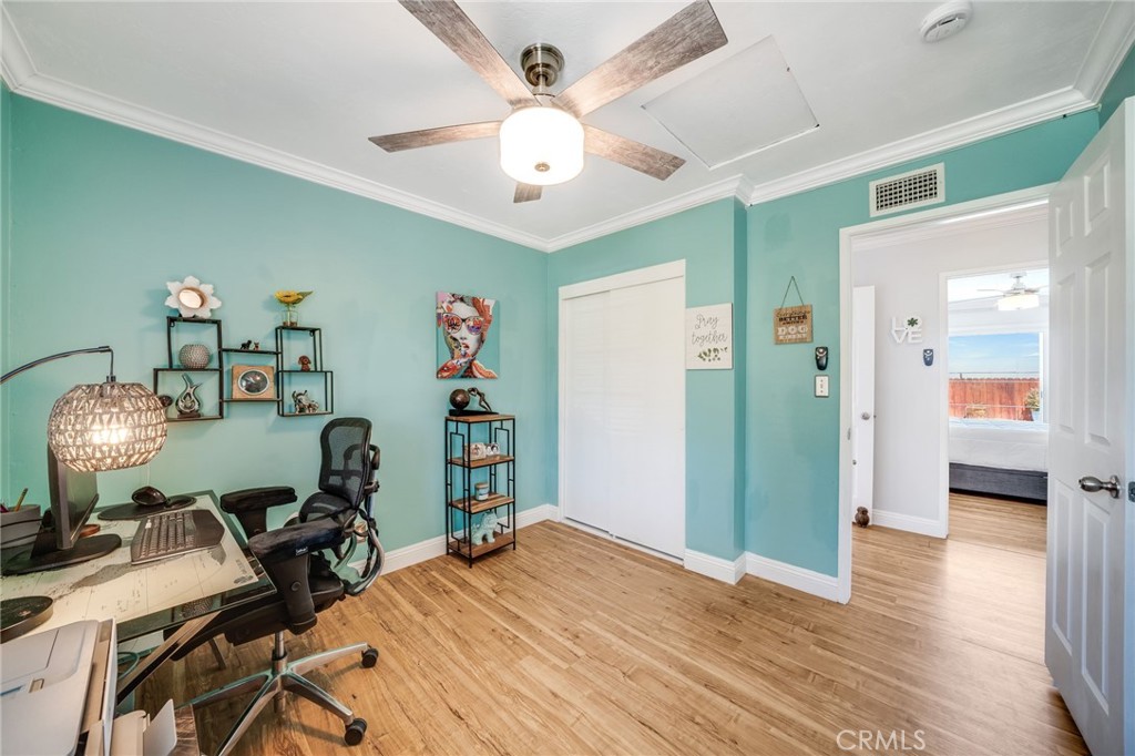 1935 Adobe Avenue Corona, CA 92882 - Photo 17 of 45 a bedroom with furniture and a chandelier