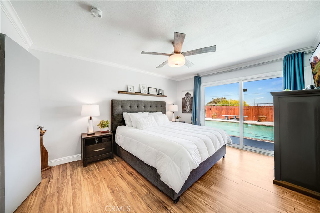 1935 Adobe Avenue Corona, CA 92882 - Photo 19 of 45 a bedroom with a bed and a flat screen tv