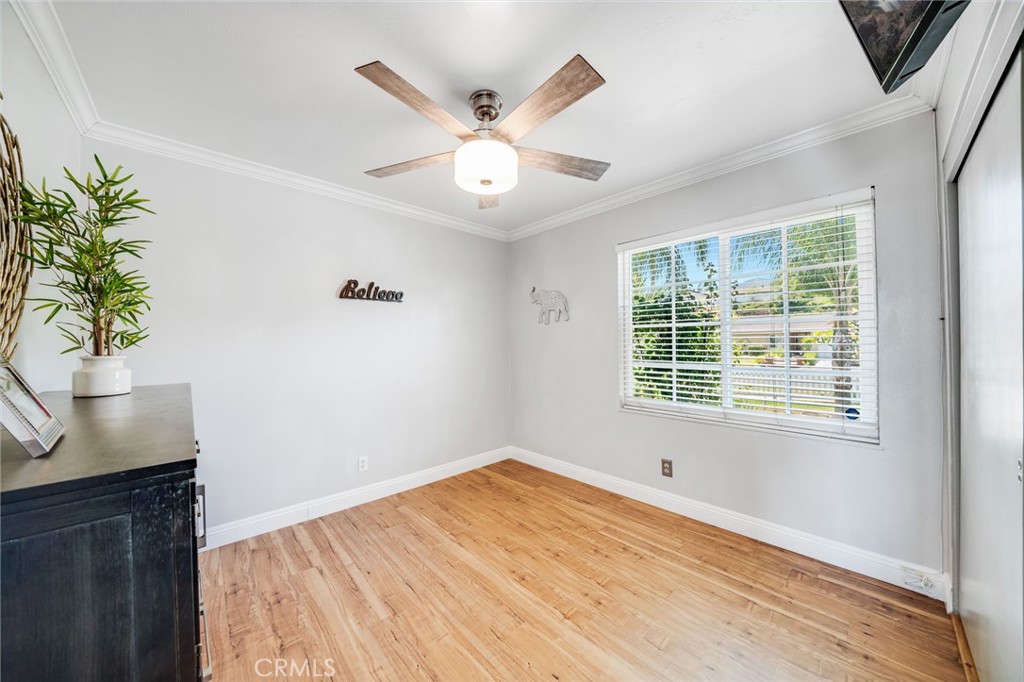 1935 Adobe Avenue Corona, CA 92882 - Photo 21 of 45 a view of an empty room with a window and wooden floor