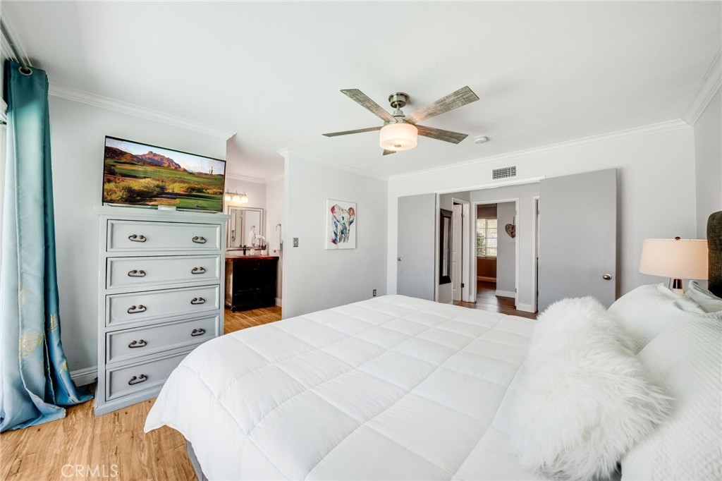 1935 Adobe Avenue Corona, CA 92882 - Photo 24 of 45 a bedroom with a bed and a flat screen tv