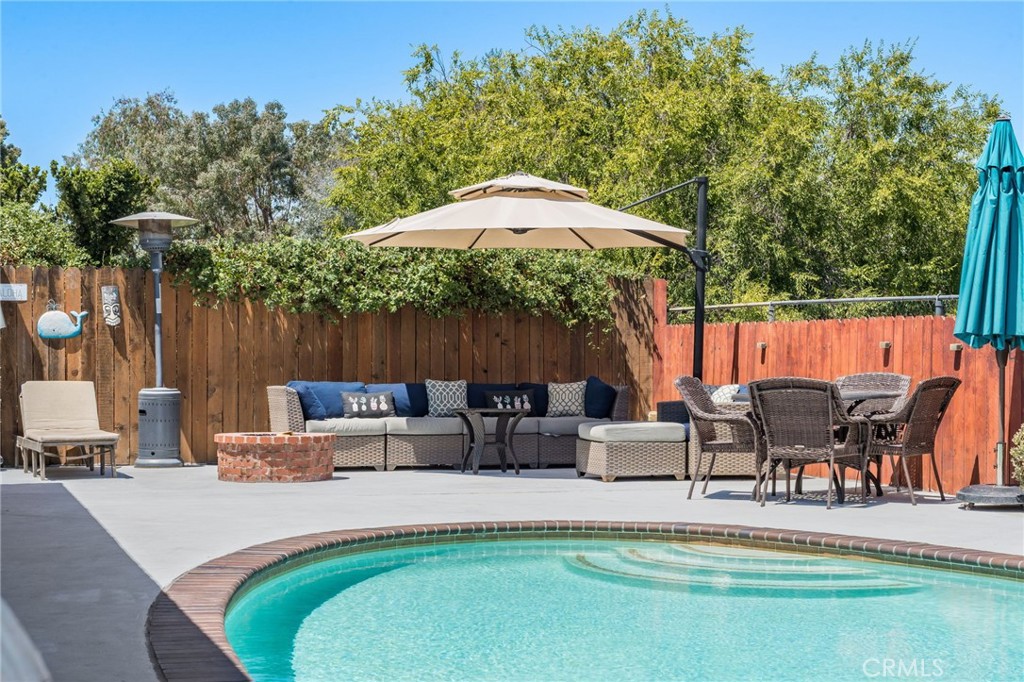 1935 Adobe Avenue Corona, CA 92882 - Photo 29 of 45 a backyard of a house with table and chairs