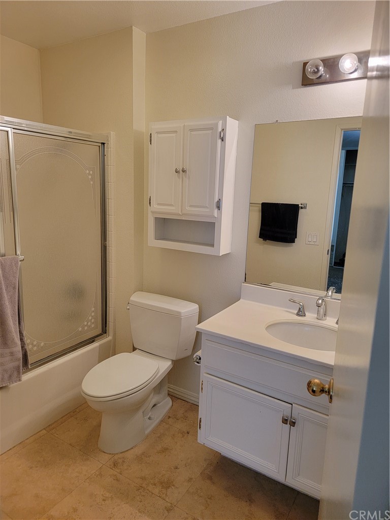 291 Chaumont Circle Lake Forest, CA 92610 - Photo 11 of 13 a bathroom with a sink a toilet and shower