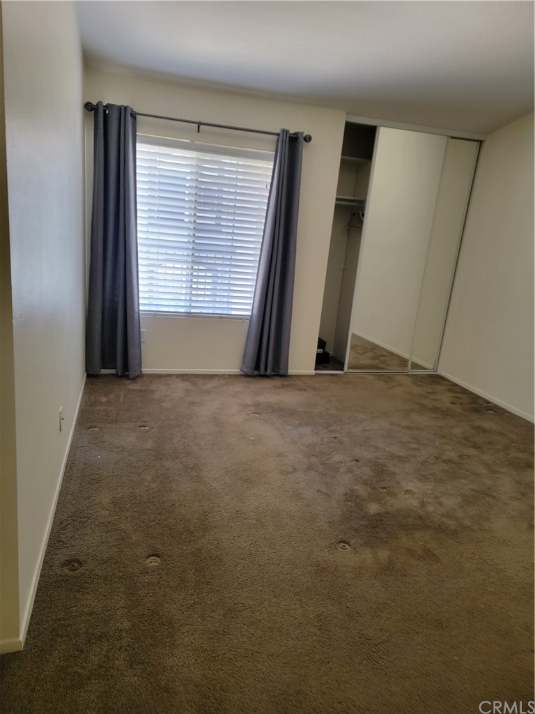 291 Chaumont Circle Lake Forest, CA 92610 - Photo 10 of 13 a view of an empty room with a window