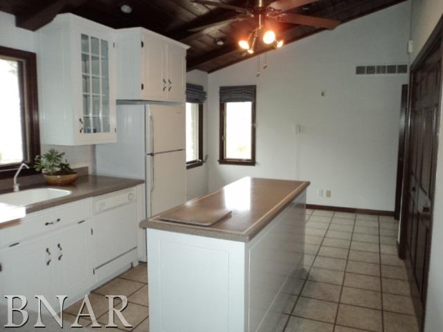 5801 Viking Road Clinton, IL 61727 - Photo 12 of 27 a kitchen with granite countertop a sink a stove and a refrigerator