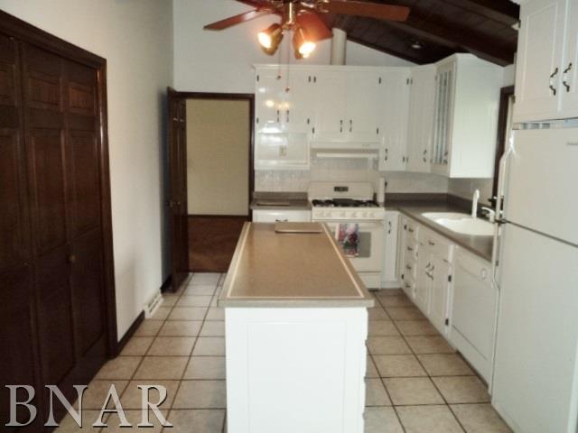 5801 Viking Road Clinton, IL 61727 - Photo 14 of 27 a kitchen that has a sink and a stove