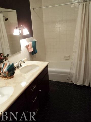 5801 Viking Road Clinton, IL 61727 - Photo 20 of 27 a bathroom with a sink a double vanity and a mirror