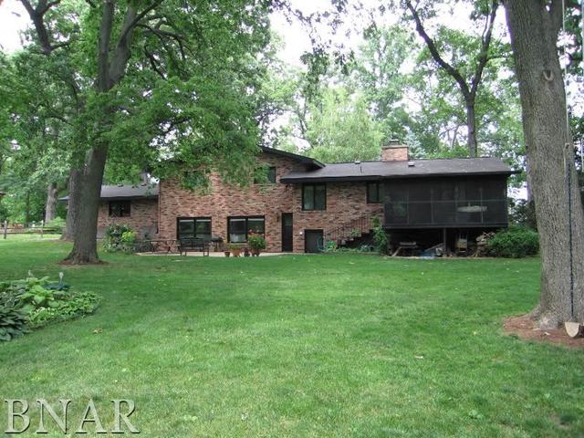 5801 Viking Road Clinton, IL 61727 - Photo 3 of 27 a front view of a house with a garden