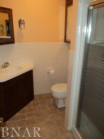 5801 Viking Road Clinton, IL 61727 - Photo 23 of 27 a bathroom with a toilet and a mirror