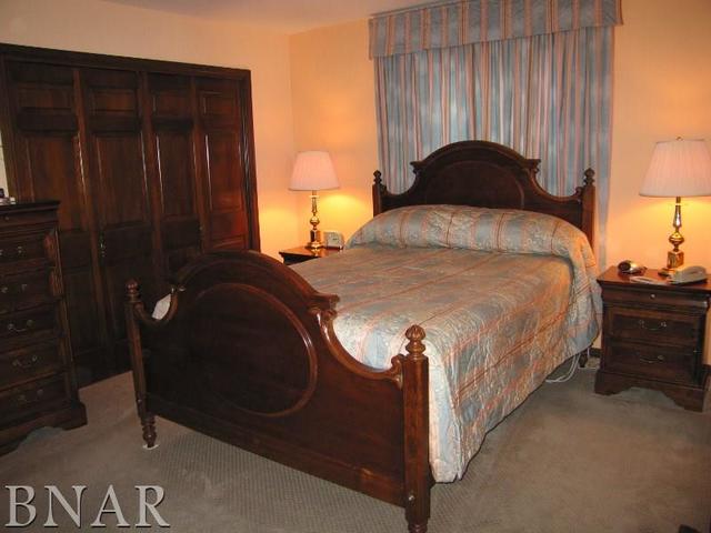 5801 Viking Road Clinton, IL 61727 - Photo 25 of 27 a bedroom with a bed and a closet