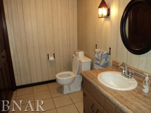 5801 Viking Road Clinton, IL 61727 - Photo 26 of 27 a bathroom with a sink and a mirror