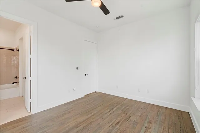an empty room with wooden floor