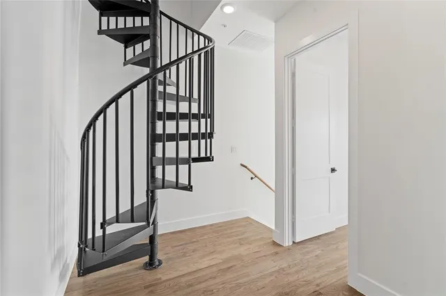 a view of a hallway with staircase