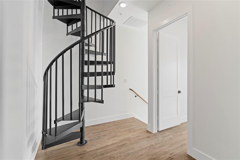 1804 Ripley Street, Unit 105 Dallas, TX 75204 - Photo 17 of 25 a view of a hallway with staircase