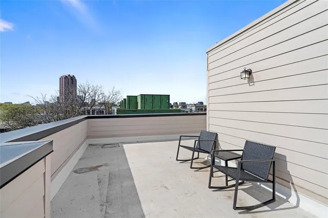 a view of balcony with furniture