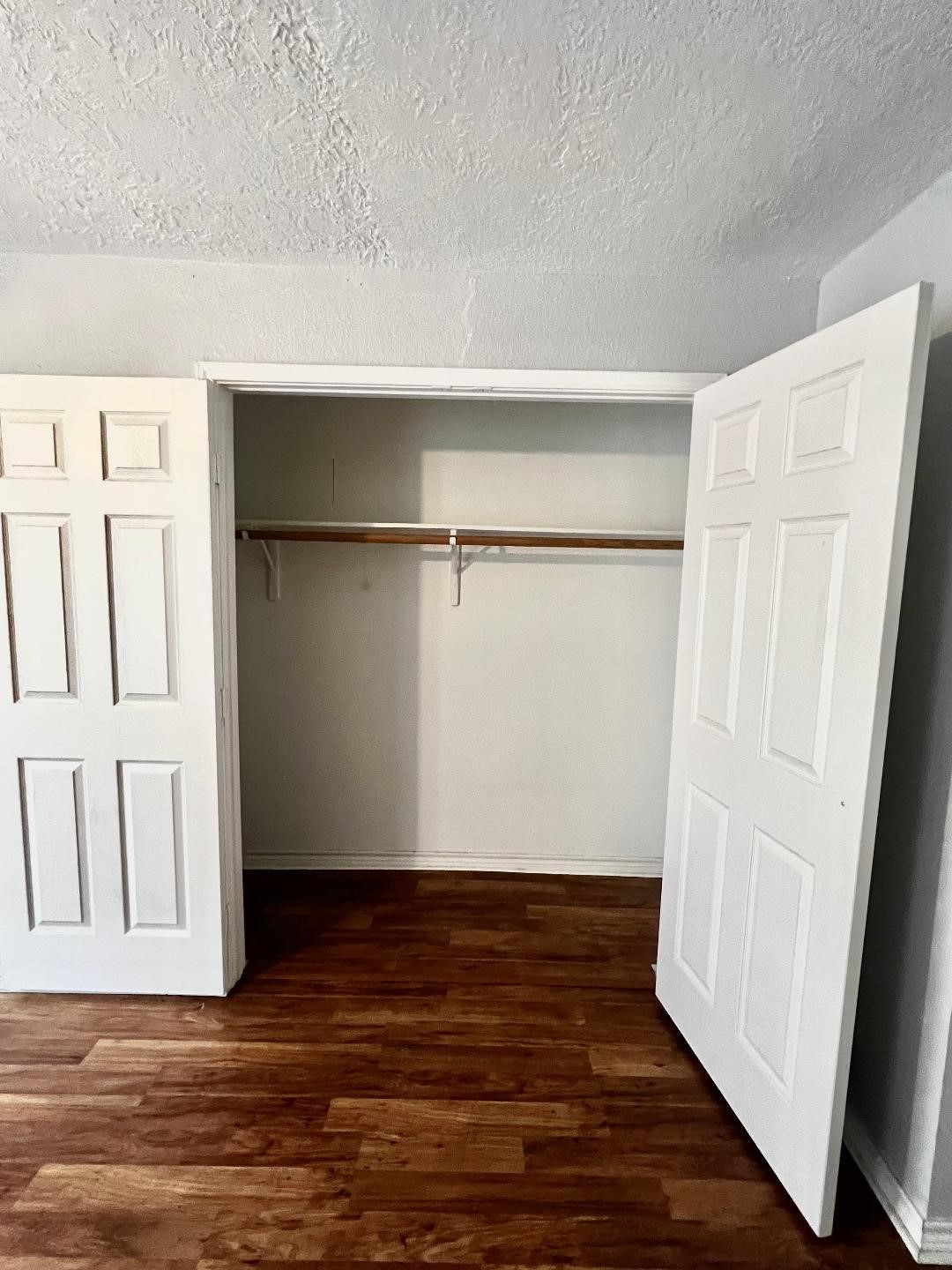 306 Rustic Drive Pasadena, TX 77502 - Photo 18 of 28 a view of an empty room with wooden floor