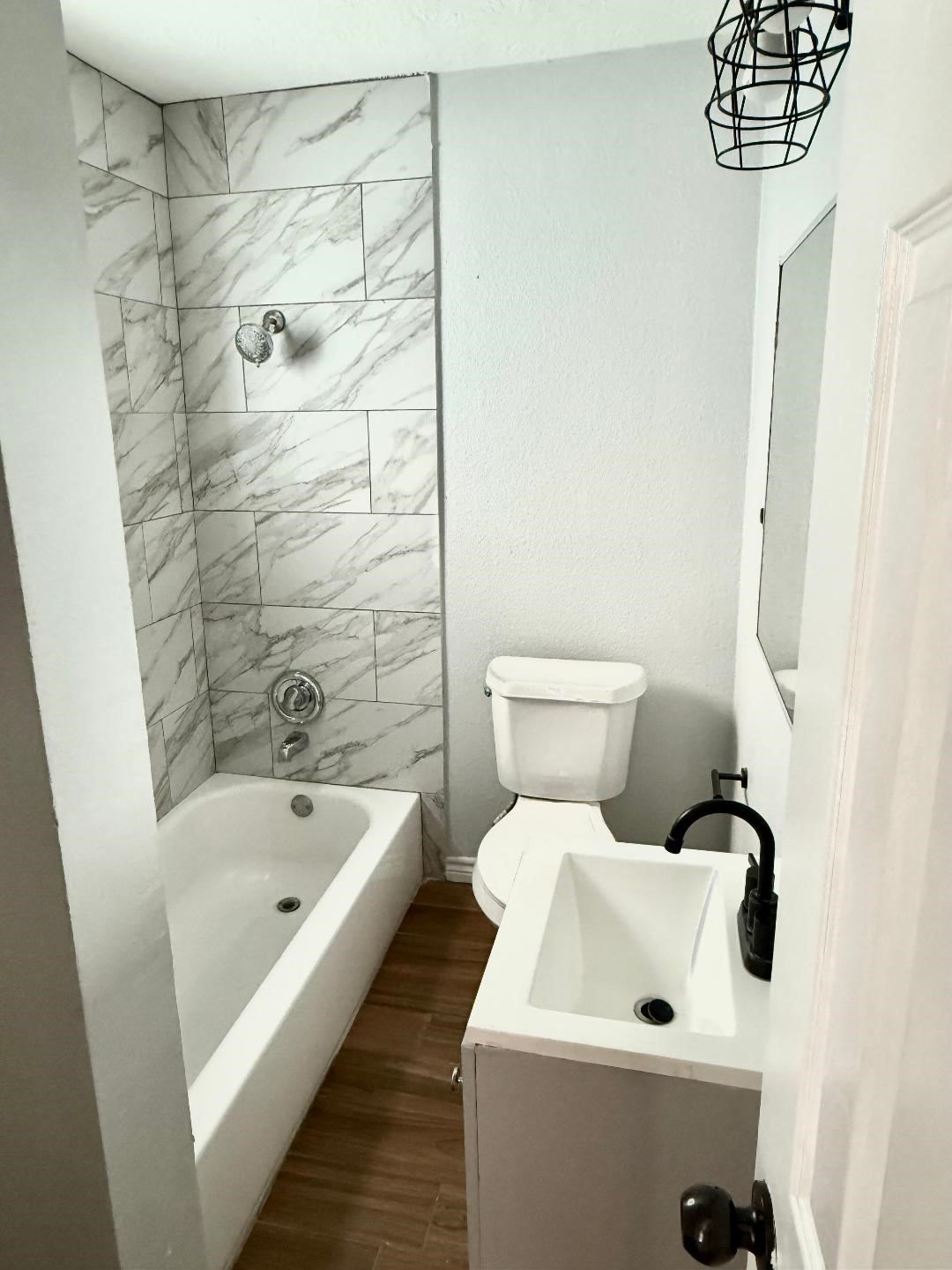 306 Rustic Drive Pasadena, TX 77502 - Photo 19 of 28 a bathroom with a bathtub and shower