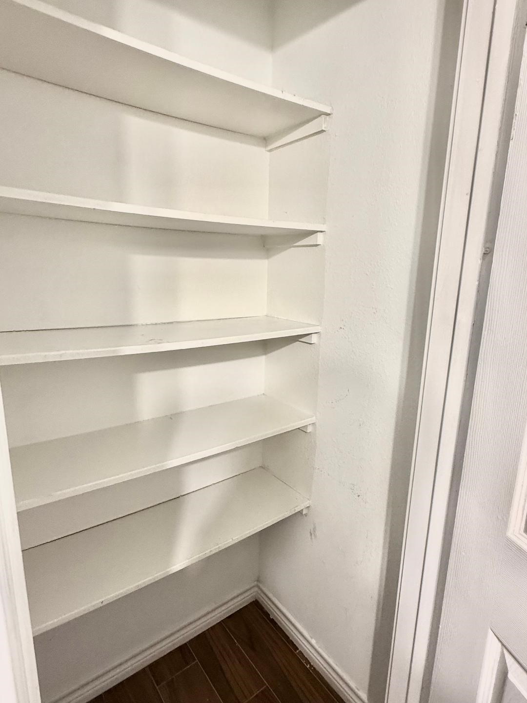 306 Rustic Drive Pasadena, TX 77502 - Photo 21 of 28 a view of walk in closet with empty racks