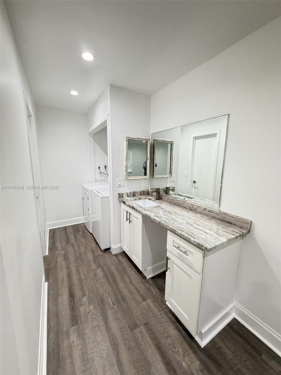 20927 Sedgewick Drive, Unit 20927 Boca Raton, FL 33433 - Photo 18 of 23 a kitchen with stainless steel appliances granite countertop a sink stove and cabinets