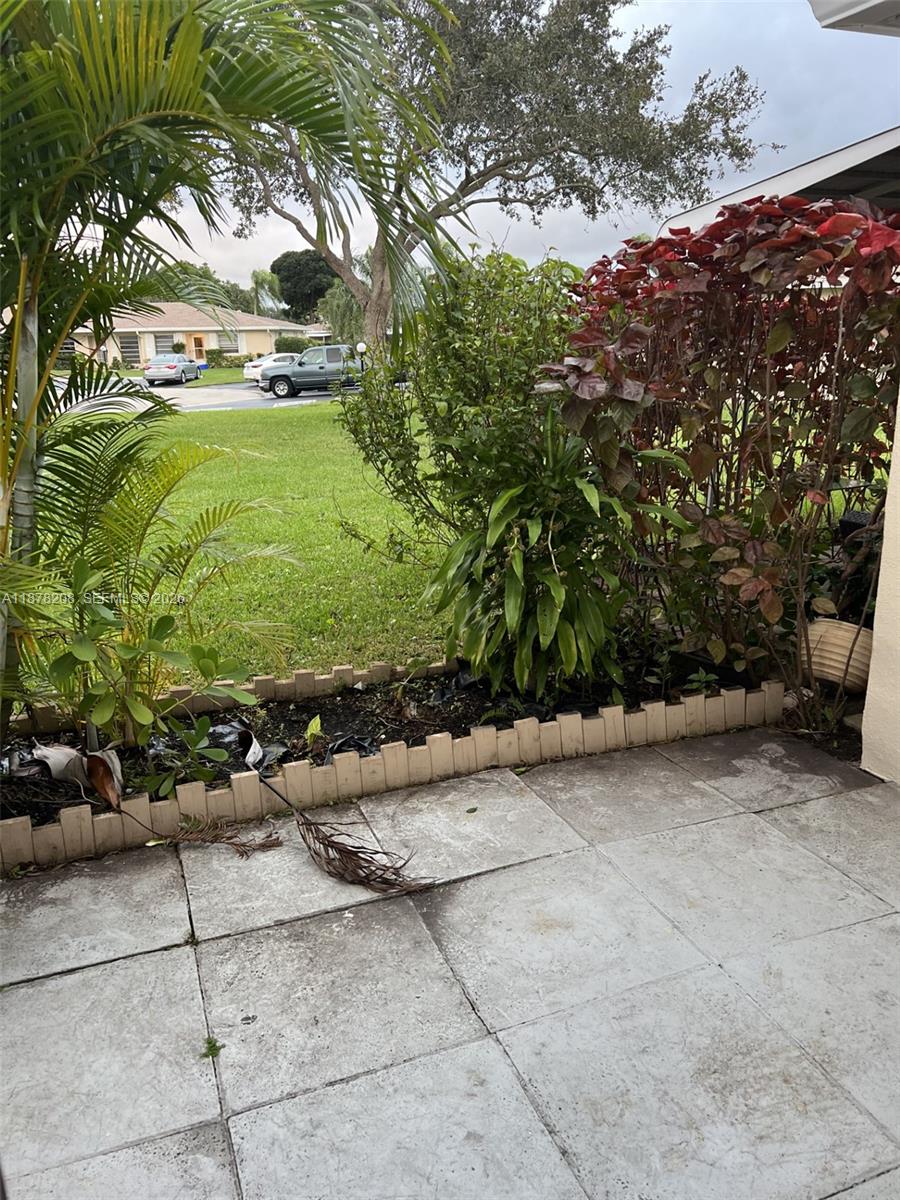 20927 Sedgewick Drive, Unit 20927 Boca Raton, FL 33433 - Photo 21 of 23 a view of a backyard of the house