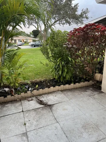 a view of a backyard of the house