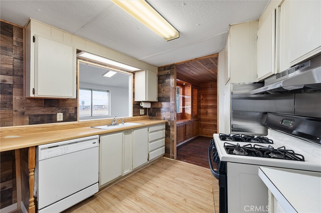 30751 Sharp Shafter, CA 93263 - Photo 26 of 73 a kitchen with sink a stove and cabinets