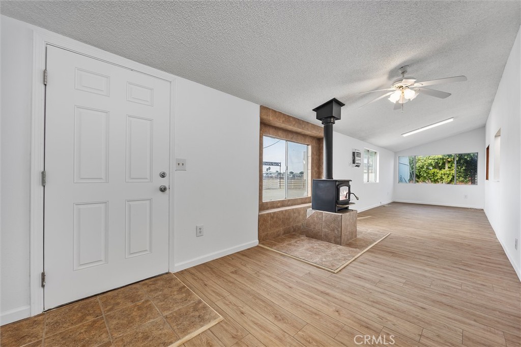 30751 Sharp Shafter, CA 93263 - Photo 30 of 73 wooden floor in an empty room with a window