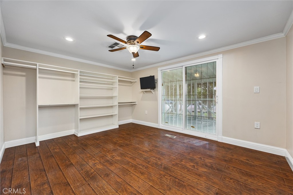 30751 Sharp Shafter, CA 93263 - Photo 34 of 73 a view of an empty room with a window and wooden floor