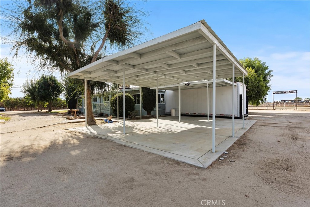 30751 Sharp Shafter, CA 93263 - Photo 38 of 73 a view of a house with a backyard space and a garage