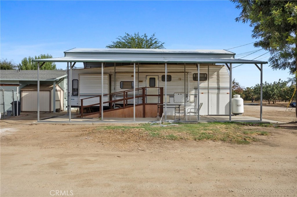 30751 Sharp Shafter, CA 93263 - Photo 65 of 73 a front view of a house with a garden and patio