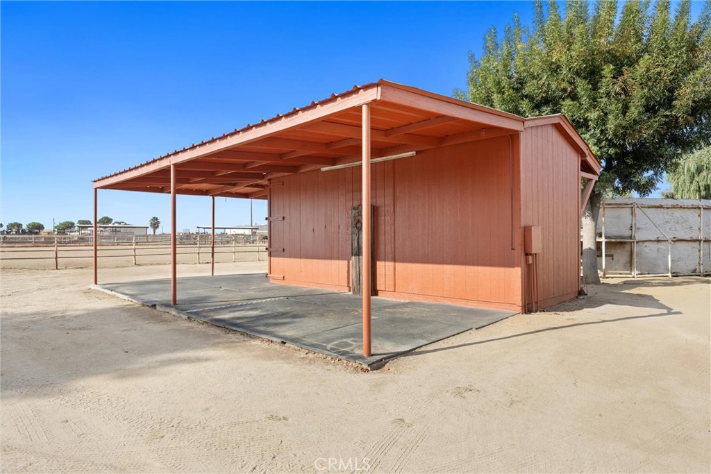 30751 Sharp Shafter, CA 93263 - Photo 71 of 73 a blue umbrella sitting in front of a house