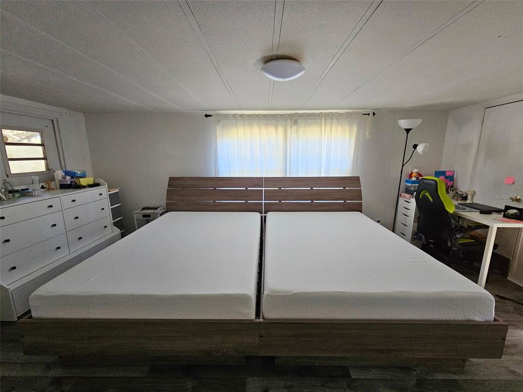 8603 Alafia Ridge Road Riverview, FL 33569 - Photo 10 of 13 a bedroom with a bed and window