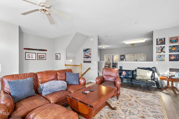 a living room with furniture and a rug