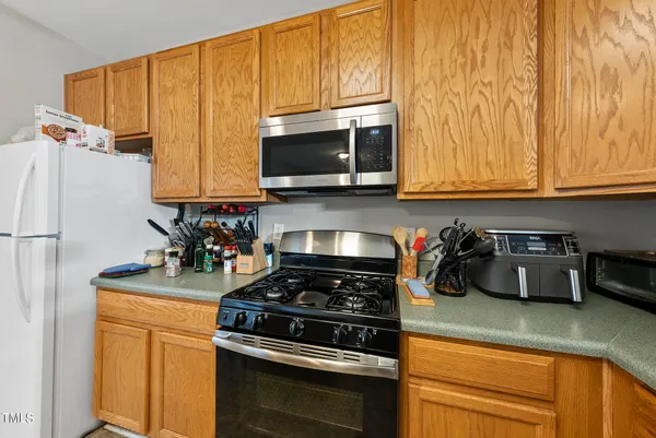 a kitchen with a stove and a microwave