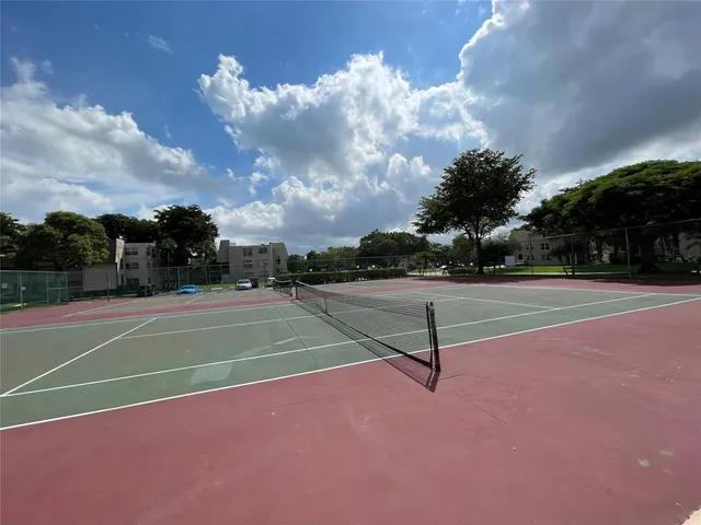 a view of a playground with basketball court
