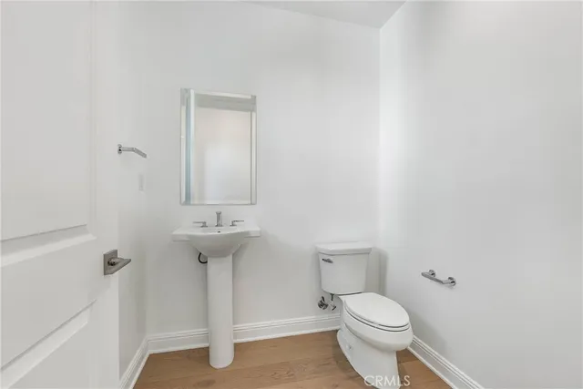 a kitchen with stainless steel appliances kitchen island granite countertop a table and chairs