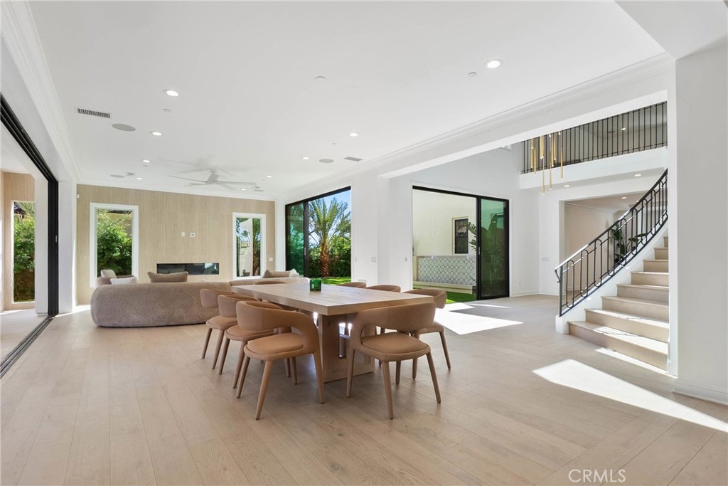 20448 Liverpool Way Porter Ranch, CA 91326 - Photo 14 of 60 a view of a dining room with furniture window and wooden floor