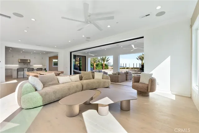 a large kitchen with stainless steel appliances granite countertop a stove a sink and a refrigerator