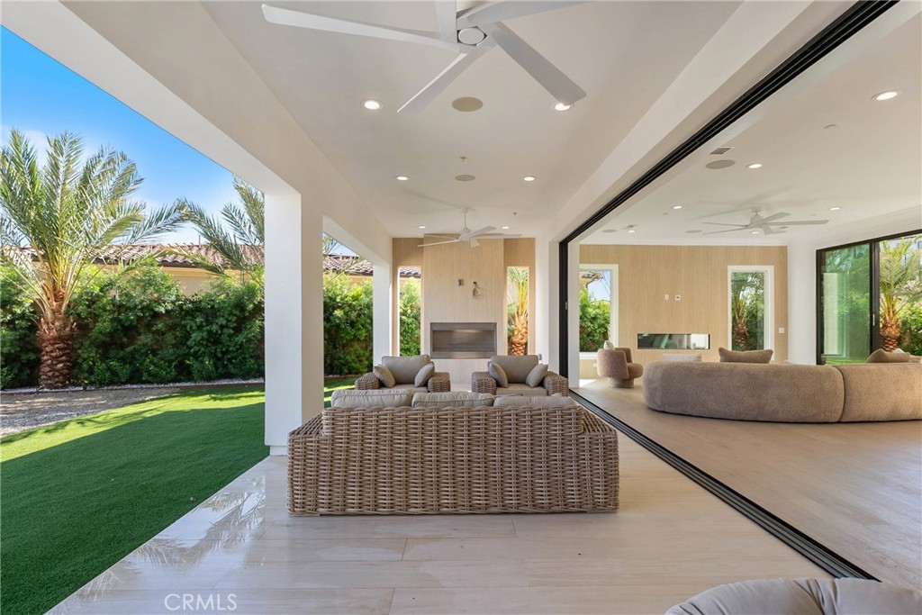 20448 Liverpool Way Porter Ranch, CA 91326 - Photo 22 of 60 a living room with a large window and a couch