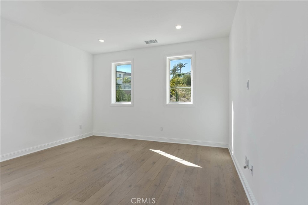 20448 Liverpool Way Porter Ranch, CA 91326 - Photo 26 of 60 an empty room with windows