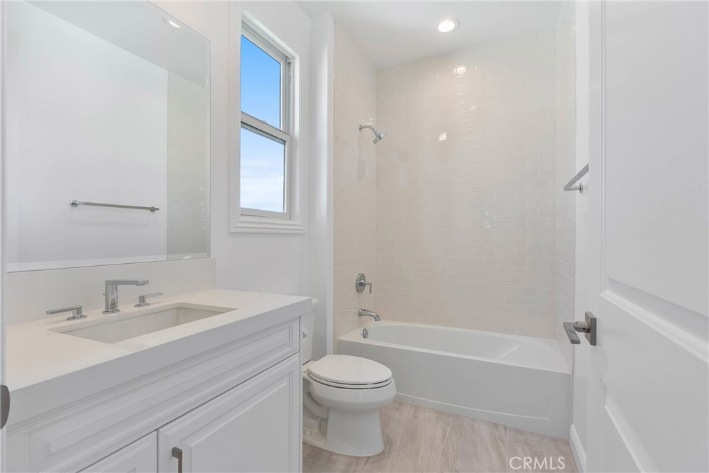20448 Liverpool Way Porter Ranch, CA 91326 - Photo 28 of 60 a bathroom with a sink toilet and shower