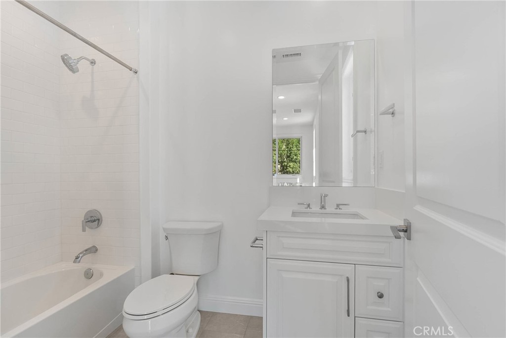 20448 Liverpool Way Porter Ranch, CA 91326 - Photo 30 of 60 a bathroom with a sink vanity toilet and shower