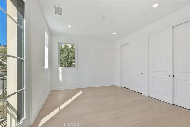 a bathroom with a bathtub shower sink and mirror