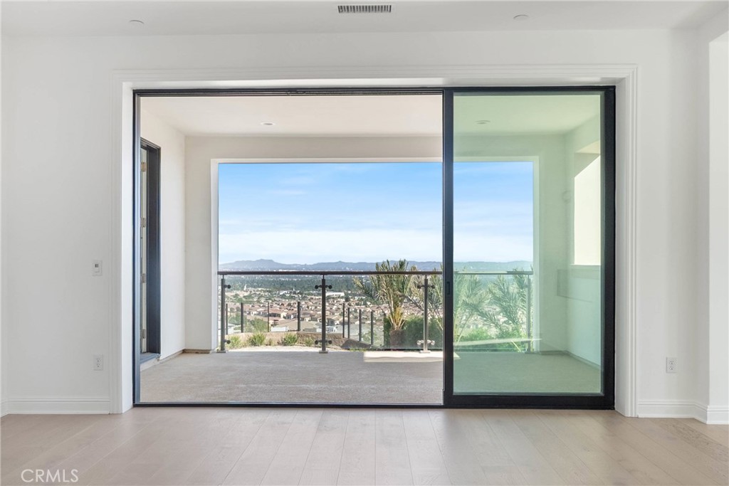 20448 Liverpool Way Porter Ranch, CA 91326 - Photo 45 of 60 a room with a large window and a bed